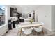 Open-concept kitchen and dining area featuring modern decor and wood flooring at 522 Meridian Ln, Superior, CO 80027
