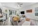 Bright living room with hardwood floors, modern furnishings, and a sliding glass door at 522 Meridian Ln, Superior, CO 80027