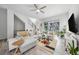 Bright living room with modern furnishings, large window, and neutral color palette at 522 Meridian Ln, Superior, CO 80027