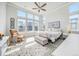 Bright main bedroom with large windows, a ceiling fan, and neutral decor at 522 Meridian Ln, Superior, CO 80027