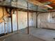 Unfinished basement with a concrete floor and exposed pipes at 3824 S Quemoy Way, Aurora, CO 80018