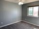 Carpeted bedroom featuring a ceiling fan and natural light from a window at 3824 S Quemoy Way, Aurora, CO 80018