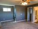 Spacious bedroom featuring soft carpet, natural lighting, and neutral walls at 3824 S Quemoy Way, Aurora, CO 80018