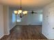 View of the dining room showing floors, lighting, and windows at 3824 S Quemoy Way, Aurora, CO 80018