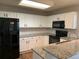 Updated kitchen with stainless steel appliances and granite countertops at 3824 S Quemoy Way, Aurora, CO 80018