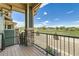 Inviting balcony with decorative stone accents, offering a charming outdoor space with a picturesque view of the neighborhood at 4795 E 98Th Pl, Thornton, CO 80229