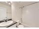 Bathroom features a vanity, toilet, and shower-tub combination with white tiles at 4795 E 98Th Pl, Thornton, CO 80229