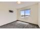 Carpeted bedroom illuminated by natural light streaming through a large window at 4795 E 98Th Pl, Thornton, CO 80229