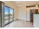 Cozy dining area with access to a balcony, seamlessly connected to a modern kitchen, enhancing the living experience at 4795 E 98Th Pl, Thornton, CO 80229