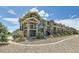 Green townhomes featuring stone accents, private balconies, and well-maintained landscaping, exuding curb appeal and inviting charm at 4795 E 98Th Pl, Thornton, CO 80229