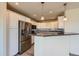 Contemporary kitchen with stainless steel appliances, white cabinetry, and a stylish island, ideal for culinary enthusiasts at 4795 E 98Th Pl, Thornton, CO 80229