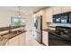 Bright kitchen with stainless steel appliances, modern countertops, and ample storage, blending style with practicality at 4795 E 98Th Pl, Thornton, CO 80229