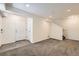 Spacious living room with neutral walls, carpet flooring, and a stairway at 4795 E 98Th Pl, Thornton, CO 80229