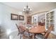 A dining room featuring hardwood floors, chandelier, and french doors leading to other areas of the home at 12136 Desert Hills St, Parker, CO 80138