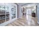 Inviting entryway featuring hardwood floors and arched doorways leading to different areas of the home at 12136 Desert Hills St, Parker, CO 80138