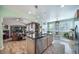 Bright kitchen with stainless appliances and granite island with seating, seamlessly connected to a cozy breakfast nook at 12136 Desert Hills St, Parker, CO 80138