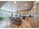 Bright, open kitchen with stainless steel appliances, granite countertops, ample cabinet space, and a breakfast bar at 12136 Desert Hills St, Parker, CO 80138