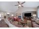Open living room with vaulted ceilings, a fireplace, and hardwood floors, creating a comfortable atmosphere at 12136 Desert Hills St, Parker, CO 80138
