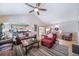 Spacious living room features vaulted ceilings, wood floors, comfortable seating and seamlessly connects to the kitchen at 12136 Desert Hills St, Parker, CO 80138