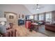 Spacious living room with a fireplace, vaulted ceilings, and hardwood floors, ideal for relaxation at 12136 Desert Hills St, Parker, CO 80138