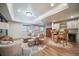 Open-concept living room with a kitchenette, stylish furnishings, and recessed lighting at 12136 Desert Hills St, Parker, CO 80138
