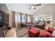 Bright living room with hardwood floors and an open layout, seamlessly connecting to the kitchen and dining area at 12136 Desert Hills St, Parker, CO 80138