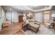 Spacious living room featuring hard wood floors and a view of the kitchen and dining area at 12136 Desert Hills St, Parker, CO 80138