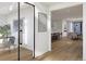 A modern home showcasing an open-concept living space that connects the dining area and office at 2758 Utica St, Denver, CO 80212