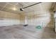 Spacious three-car garage with high ceilings and ample storage space at 12717 Madison Ct, Thornton, CO 80241