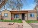 Charming home with a well-maintained front yard, inviting walkway, and cozy porch chairs at 675 S Quivas St, Denver, CO 80223