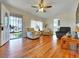 Inviting living room with hardwood floors, comfortable seating, and an open entrance with natural light at 675 S Quivas St, Denver, CO 80223