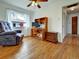 Inviting living room featuring hardwood floors and a computer desk for a comfortable workspace at 675 S Quivas St, Denver, CO 80223