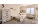 Charming bedroom furnished with a twin bed, dresser, desk, and decorated with minimalist wall art at 6694 S Rome St, Aurora, CO 80016