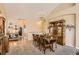 Elegant dining room featuring a chandelier, carpet, and wood furniture at 6694 S Rome St, Aurora, CO 80016
