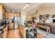 Open kitchen featuring granite countertops, stainless steel appliances, and an island at 6694 S Rome St, Aurora, CO 80016