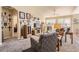 Inviting living room featuring a fireplace, ceiling fan, and neutral decor at 6694 S Rome St, Aurora, CO 80016