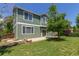 Backyard featuring a lawn, patio and green exterior at 19466 E 59Th Dr, Aurora, CO 80019