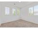 Bright bedroom with carpet, large windows, and neutral paint at 19466 E 59Th Dr, Aurora, CO 80019