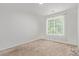 Bright bedroom featuring plush carpet, natural light and neutral walls at 19466 E 59Th Dr, Aurora, CO 80019