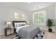 Bedroom with modern decor, large window and neutral walls at 19466 E 59Th Dr, Aurora, CO 80019