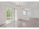 Bright dining area features sliding door access to backyard, and a simple light fixture at 19466 E 59Th Dr, Aurora, CO 80019