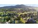 Scenic aerial view of the community, highlighting its natural surroundings, and mountain views at 31402 N Bermuda Dunes Dr, Evergreen, CO 80439