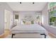 Bright bedroom features natural light, stylish decor, and a comfortable, inviting atmosphere at 31402 N Bermuda Dunes Dr, Evergreen, CO 80439