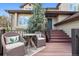 Inviting front deck with comfortable seating, offering a relaxing space to enjoy the outdoors and views at 31402 N Bermuda Dunes Dr, Evergreen, CO 80439