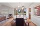 Bright dining room features a large picture window and modern light fixture at 31402 N Bermuda Dunes Dr, Evergreen, CO 80439