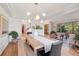 Dining room features wood floors and a large table perfect for entertaining at 31402 N Bermuda Dunes Dr, Evergreen, CO 80439