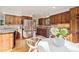 Spacious kitchen features wooden cabinets, stainless appliances, and granite countertops at 31402 N Bermuda Dunes Dr, Evergreen, CO 80439