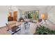Bright living room with ample natural light, stylish decor, and hardwood flooring at 31402 N Bermuda Dunes Dr, Evergreen, CO 80439