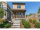 Charming home with a covered porch and well-maintained landscaping at 12794 Tamarac St, Thornton, CO 80602