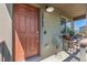 Inviting front porch with a cozy seating area and a well-lit entrance at 12794 Tamarac St, Thornton, CO 80602
